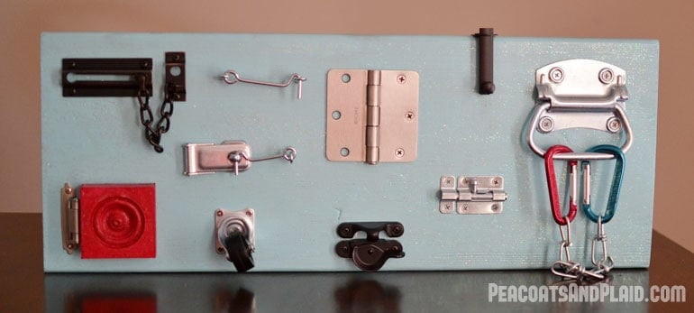 Toddler approved DIY busy latch board tutorial to keep your energetic child entertained.