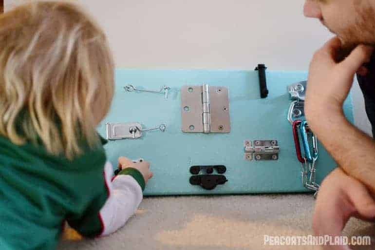 Toddler approved DIY busy latch board tutorial to keep your energetic child entertained.