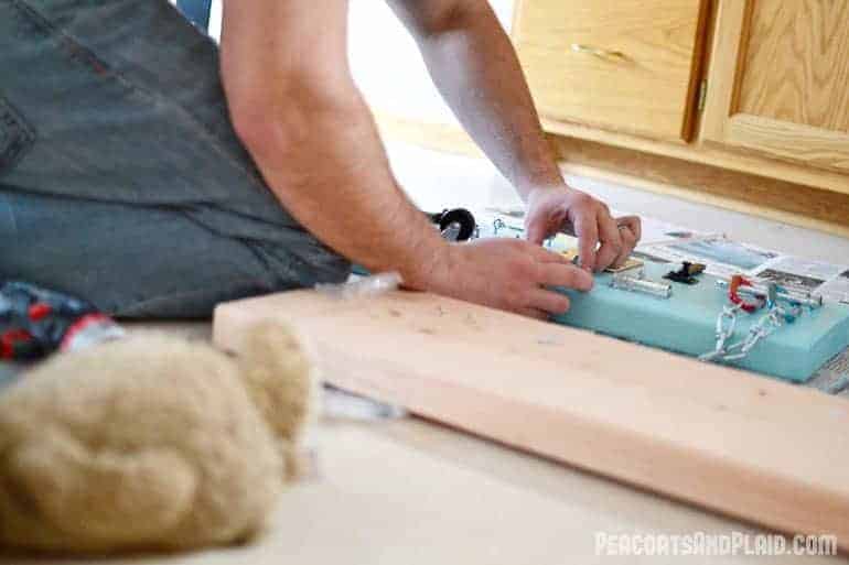 Toddler approved DIY busy latch board tutorial to keep your energetic child entertained.