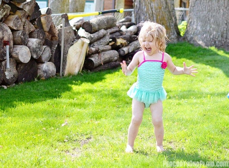 Toddler summer time fun in the sprinkler.