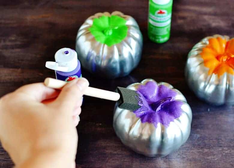 This is the perfect budget Halloween decor project. Love these cute glitter frosted mini pumpkins!