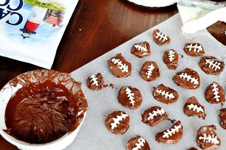 Look no further for your next football party food idea! These chocolate covered potato chip footballs are the perfect sweet and salty dessert.