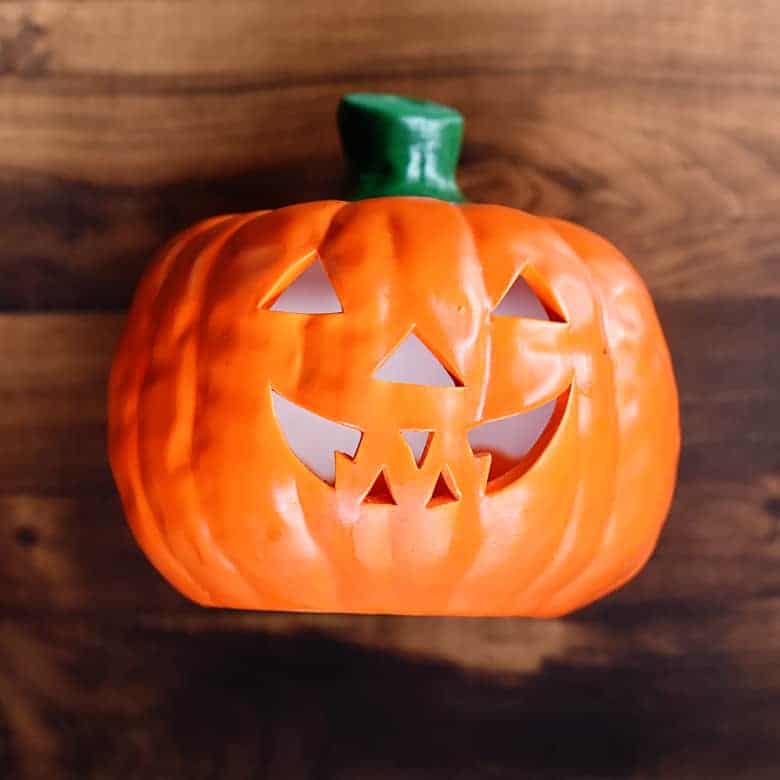 If you see one of these ceramic pumpkins at the thrift store, don't pass them up! This thrift store Halloween decor makeover of this pumpkin is so easy!