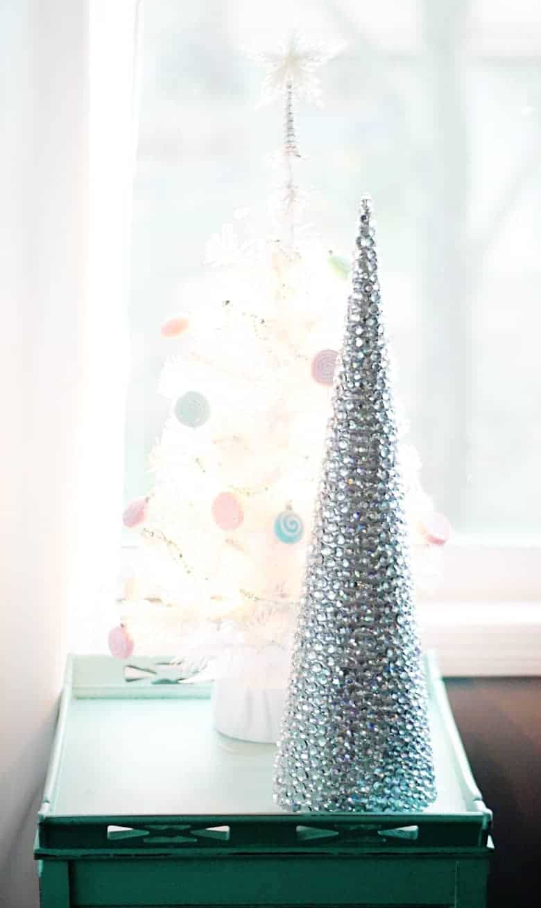 This rhinestone mini Christmas tree craft is a fun and easy holiday DIY idea that would make a great centerpiece or mantle decor.