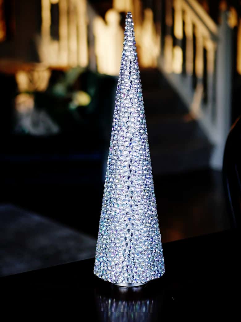 This rhinestone mini Christmas tree craft is a fun and easy holiday DIY idea that would make a great centerpiece or mantle decor.