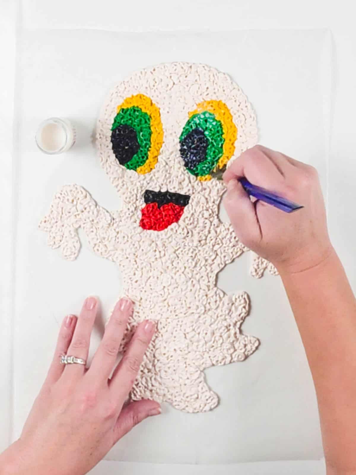 Gloss glaze applied with a paintbrush to the textured surface of a Sculpey Halloween decoration