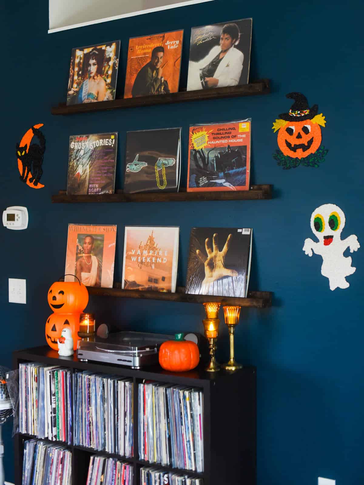 Handmade vintage-inspired Halloween popcorn decoration hanging on a wall