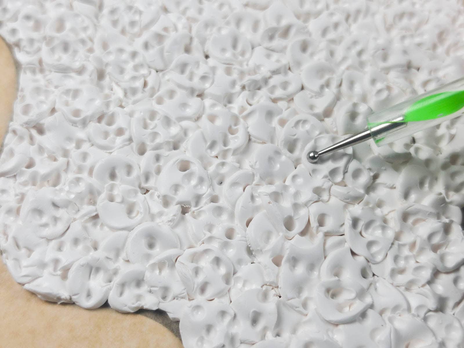 Close-up of textured polymer clay sections joined together before baking